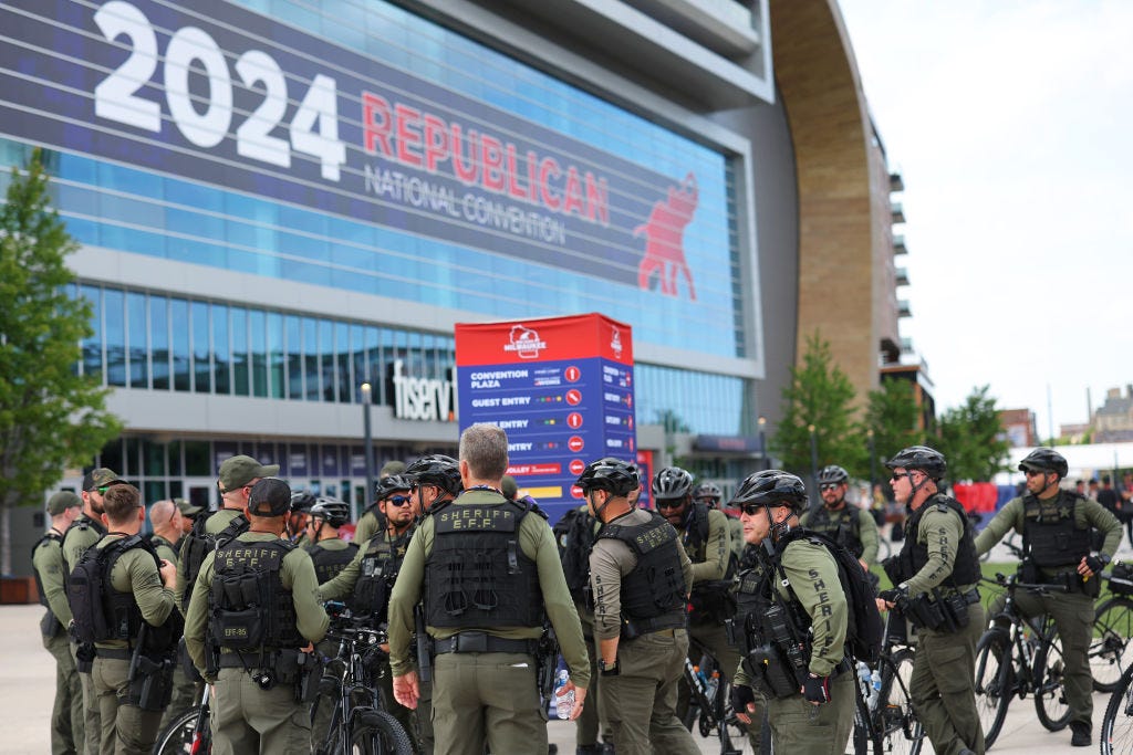 Law enforcement officers stand outside Fiserv Forum in Milwaukee ahead of the Republican National Convention.