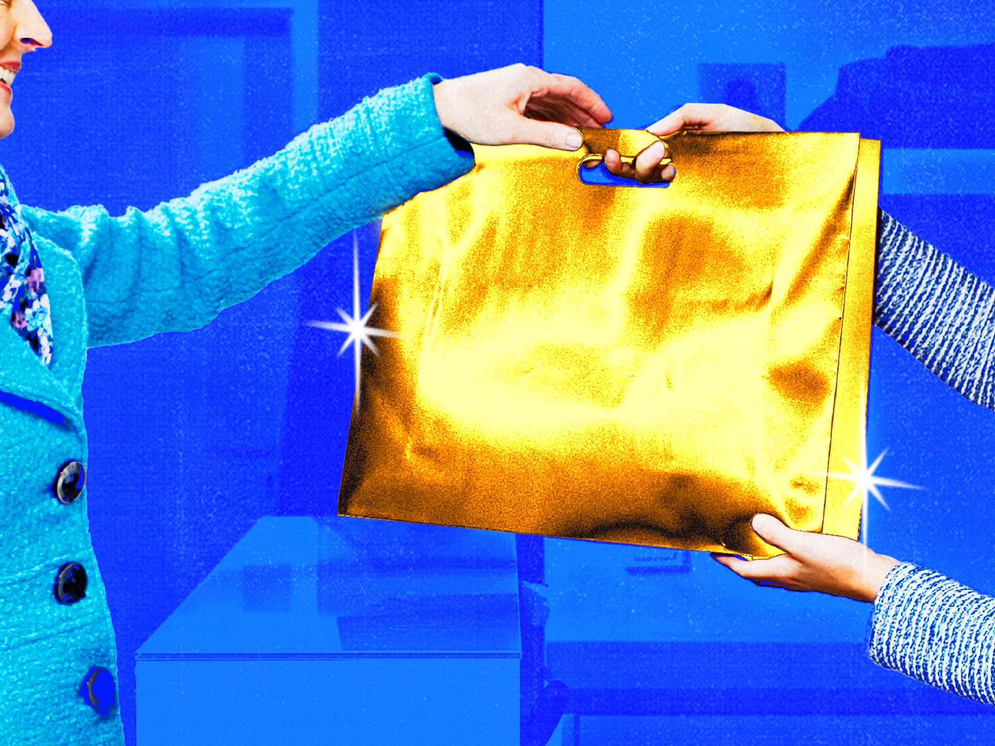 Store clerk handing over a luxury golden shopping bag to a shopper