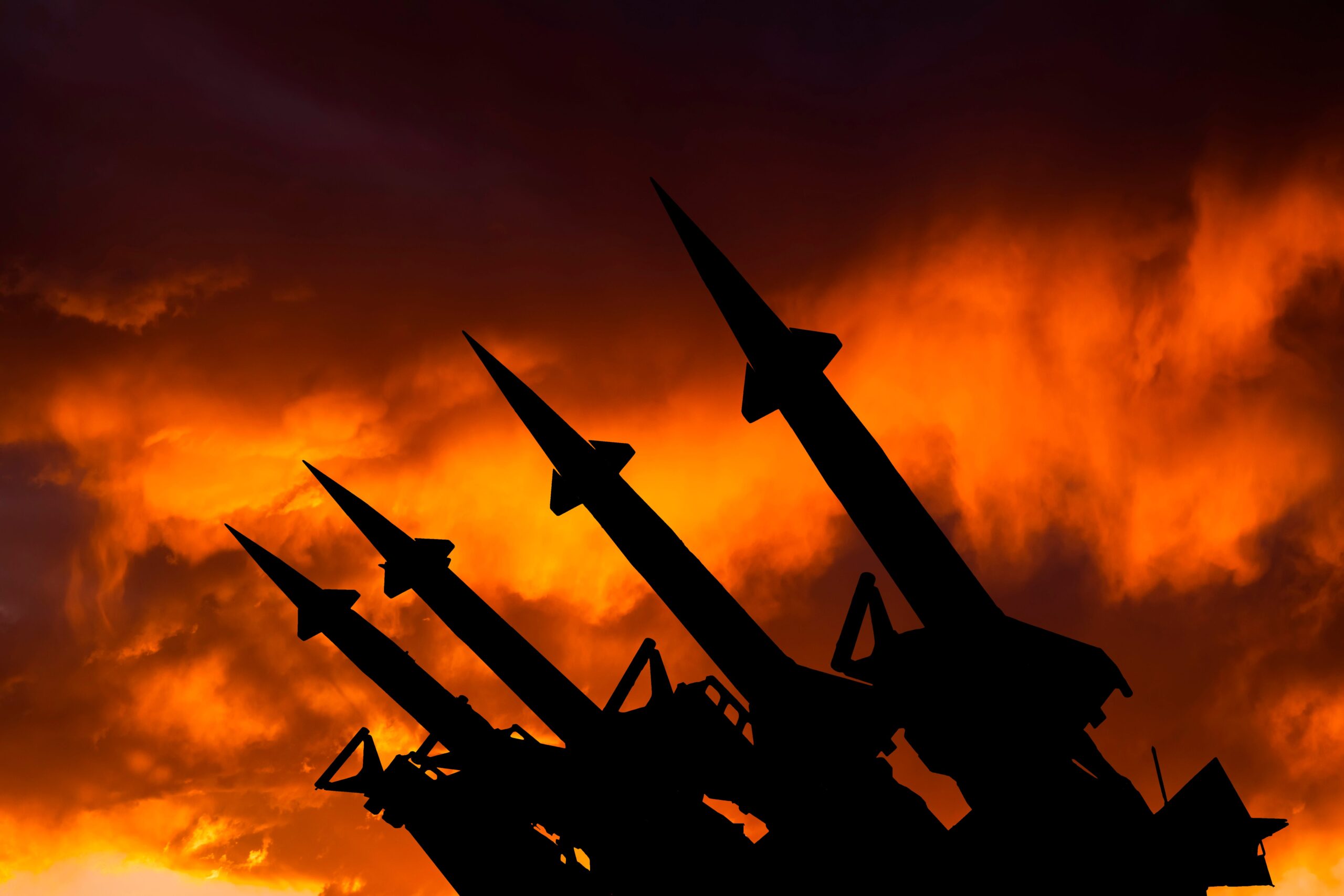 A missile system on the background of a sunset sky.